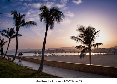 Sunset On The Promenade Of Caleta De Fuste With Unrecognizable People, Fuerteventura 