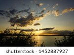 sunset on river with bridge