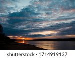 sunset on the river with clouds