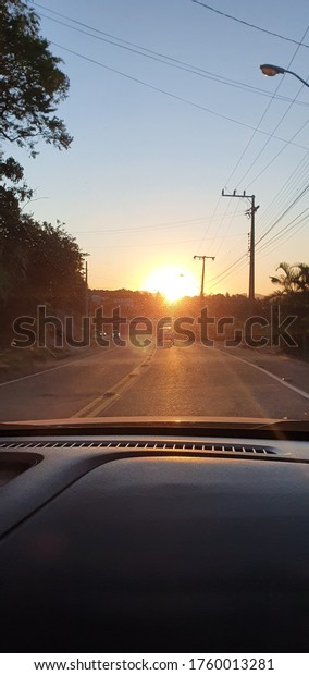 sunset on the road inside the car -\
Blumenau/Santa Catarina/Brasil -\
05-08-2020