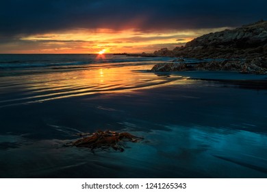 sunset on the rocky seashore