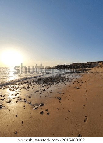 Sunset on a Sandy Beach in Vila Nova de Milfontes, Portugal