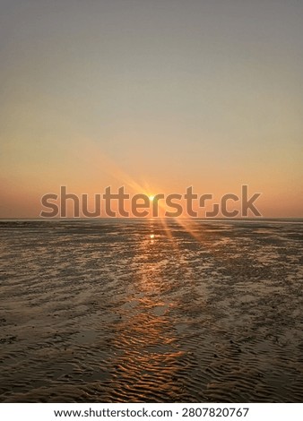 Sunset on Sandy Brancaster Beach in Norfolk