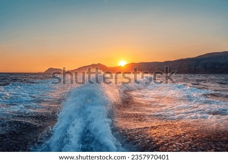 
Sunset on the sea with waves and splashes between Capri and Positano, Amalfi coast, Italy