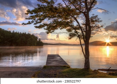 Sunset on the shore of Seventh Lake in the Fulton Chain Lakes region of the Adirondack Mountains of New York