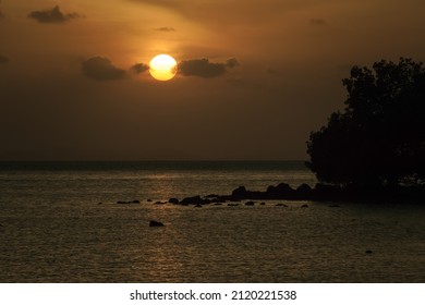 Sunset On The Shore Of Tropical Sea. Summer Vacation On Tropical Resort, Dusk Sky.