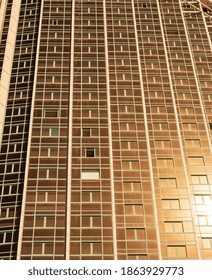 Sunset on a Skyscraper with Reflective Windows.  Evening or morning direct sunlight reflecting off of a high rise building.