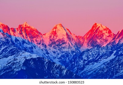 Sunset On Three Mountain Peaks In Himalaya