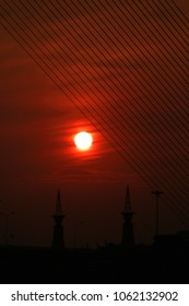 Sunset on the wire of bridge