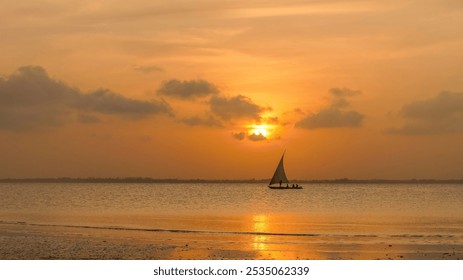 Sunset on a Zanzibar beach with a traditional dhow - Powered by Shutterstock