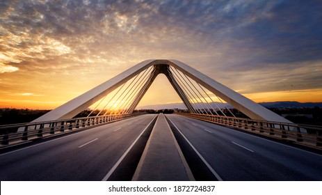 Sunset with orange clouds and blue sky at Nelson Mandela Bridge, Prat, Catalonia, Spain. - Shutterstock ID 1872724837