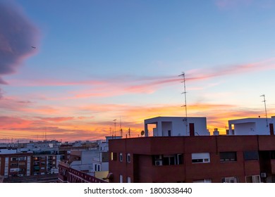 Sunset orange rooftop building sky - Shutterstock ID 1800338440