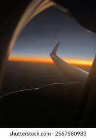 Sunset from outside of plane window