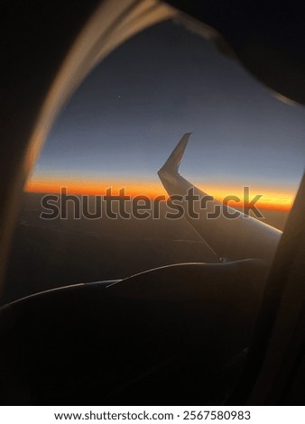 Sunset from outside of plane window