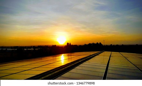 Sunset Over A 1 MW Solar Power Plant Installed For The Needs Of A New Urban Development In Kenya, Africa 