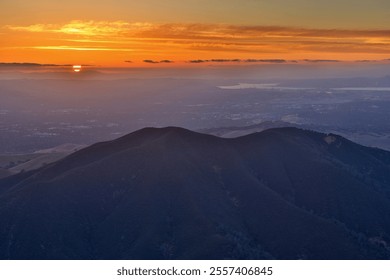 Sunset over Black Point Summit, Walnut Creek and Concord, via Eagle Peak at Mt. Diablo State Park in Contra Costa County, California, USA.