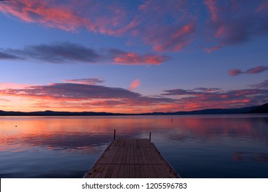 Sunset Over A Boat Dock On A Lake