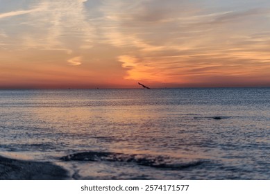 A sunset over a body of water. High quality photo