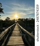 Sunset over a bridge that crosses Henderson Creek, which runs through Rookery Bay in Marco Island, Florida