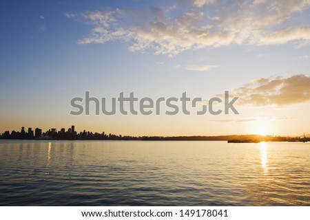 sunset over Burrard Inlet and city skyline Vancouver British Columbia Canada