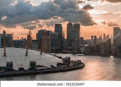Sunset over Canary Wharf and the Millennium Dome, Docklands, London.