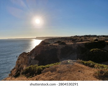 Sunset over the cliffs of Ponta da Piedade in Lagos Algarve Portugal