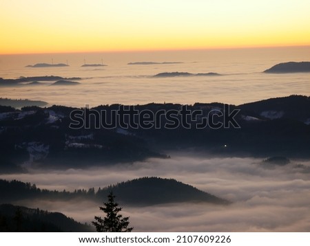 sunset over the clouds in the blackforest