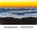 Sunset over the clouds on the top of Mauna Kea on the big island of Hawaii.