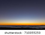 Sunset over the clouds on the top of Mauna Kea on the big island of Hawaii.