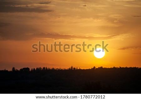 Sunset over the dark forest in Nisporeni, Moldova