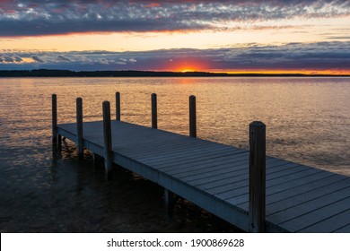 Sunset Over Dock On Torch Lake, Michigan.