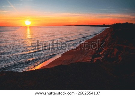 Sunset Over the Dramatic Cliffs and Calm Shores of Falesia Beach, Portugal, in Full Colorful Glory