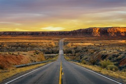 Sunset Over An Empty Road In Utah Near Its Border With Arizona, USA