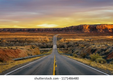 Sunset over an empty road in Utah near its border with Arizona, USA