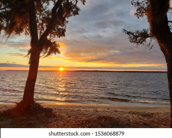 Sunset Over Escambia Bay Between Two Trees