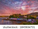 sunset over famous Quay street in Portree, Isle of Skye, Scotland