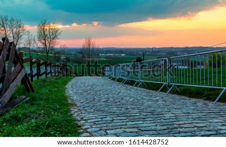 Sunset over the famous road climbing the Paterberg hill in Eastern Flanders. The road is often part of the route of Tour of Flanders.