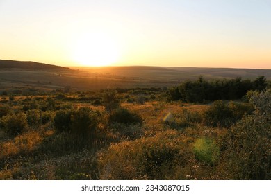 A sunset over a field