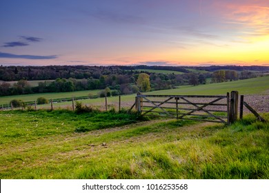 Sunset over field gate in the Chess Valley, Part of the Chiltern Hills. 