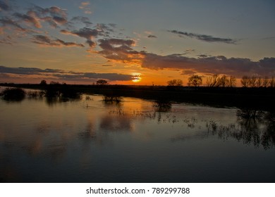 Sunset over the flooded Cambridgeshire wetlands, an area that provides sanctuary for a variety of birdlife.