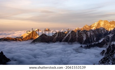 Sunset over foggy inversion in High Tatras mountains national park, Slovakia