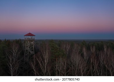 Sunset over the forests and watch tower.