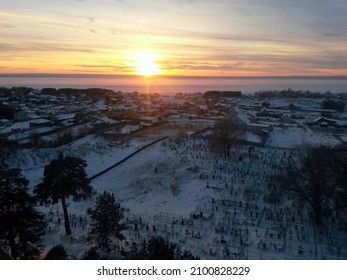 Sunset over frozen Volga river and Krasny Yar settlement in Russia
