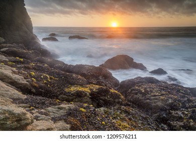 Sunset over Gray Whale Cove State Beach. Half Moon Bay, San Mateo County, California, USA.