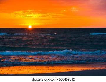 Sunset over the Gulf of Mexico on Indian Rocks Beach. Largo, Pinellas County, Florida USA