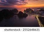 Sunset Over Ha Long Bay City, Vietnam – Illuminated Skyline and Coastal Promenade, Ideal for Travel and Urban Landscape Themes