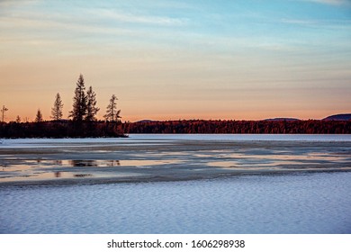 Sunset Over An Icy Lake In Raquette Lake, NY