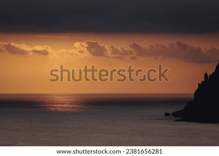 Sunset over Ionian Sea on near Sinarades village on Corfu Island, Greece