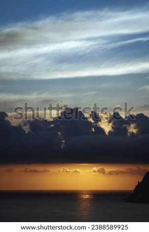 Sunset over Ionian Sea on near Sinarades village on Corfu Island, Greece
