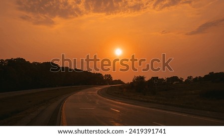 Sunset over Iowa Highway 30 near Palisades Kepler State Park